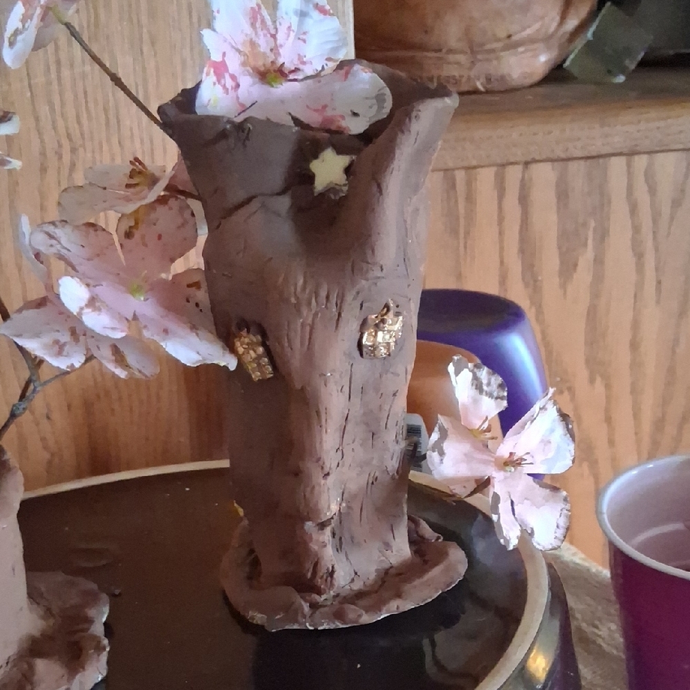 Brown Tree Trunk Sculpture with Floral Accents